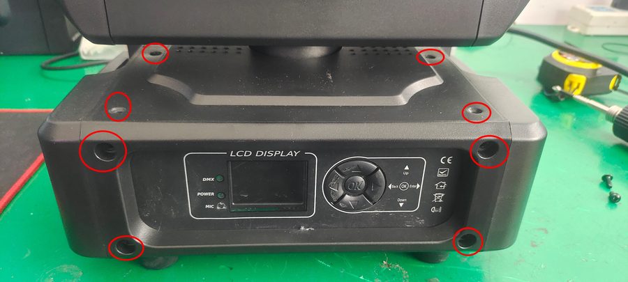 Red circle marking the eight screws that secure the display board housing